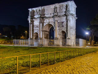 Fototapeta na wymiar Monuments of ancient Rome at night. Colosseum, Arch of Constantine and Roman Forum