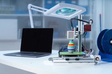 3D printer and computer on the table