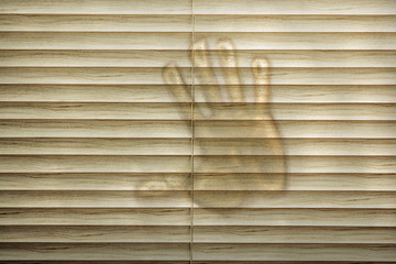 Hand print on closed blinds