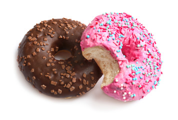 Delicious colorful donuts on white background