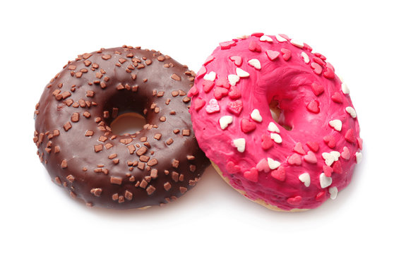 Delicious colorful donuts on white background