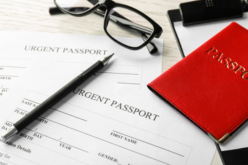 Passport and application forms on table. Immigration reform