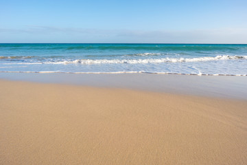 Fototapeta na wymiar The sand on the beach closeup