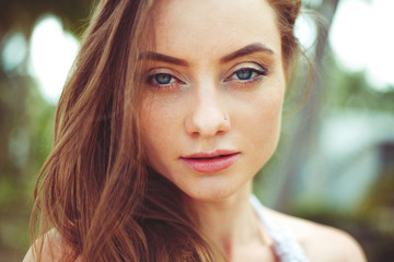 Obraz premium portrait of attractive young woman with long hair looking at camera