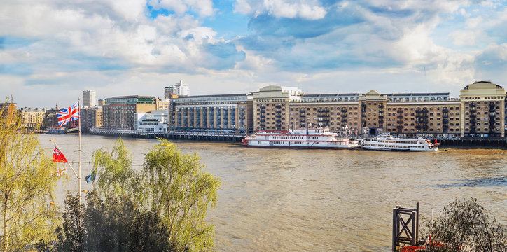 Ships in a  pier on a Thames river in London