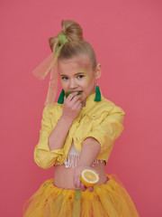 Little girl in suit of yellow lemon.