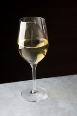 Glass of white wine on a bar counter