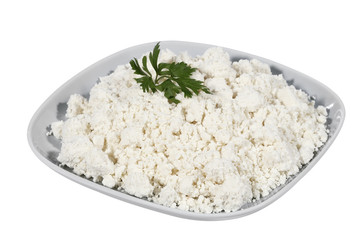 Fresh curd cheese in a bowl isolated on white background