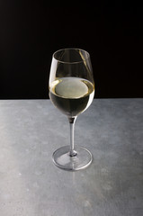 Glass of white wine on a bar counter