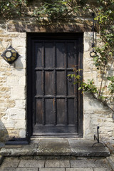 Fototapeta na wymiar Old studded wood entrance door