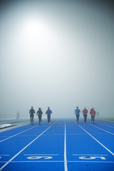 Athlete silhouette, fog, running jogging, professional track and filed