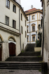 Fototapeta na wymiar Stairs in a narrow street in the center of Prague. Czech Republic