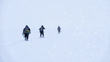 Fisherman out into the snowy expanse of the lake. Winter fishing.