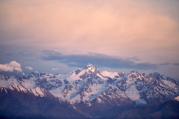 Naklejka na ściany i meble Sunset sky above the Tian-Shan mountain in Almaty, Kazakhstan.