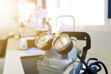 Fototapeta premium Close up pressure gauge on the air compressor use for scientific experimental. Chemical air pump used for filtrate reagents in laboratory. 