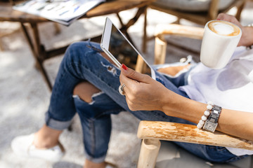 Hipster woman hands holding digital tablet with empty blank screen for your text message, business person browsing internet or connecting to wireless via touchscreen pad