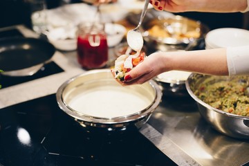 Woman decorating and eating mexican taco