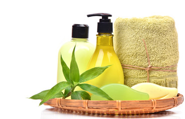 Soap, gel, towel  and cream with  bamboo  in the basket