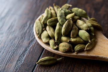 Cardamom Seeds in Wooden Spoon.