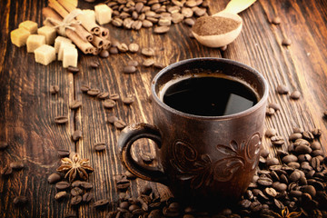 clay cup with coffee on the background of grains