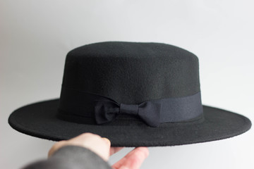 Black female hat on a white background