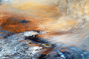 Fototapeta na wymiar Morning colors on the natural ice at the rapids of Vieremä, Forssa, Finland.