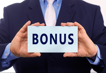 Obraz premium Business man hold paper bonus text on it