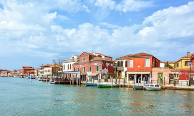Obraz premium Daylight view to Venetian Lagoon canal with parked boats