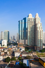 Fototapeta na wymiar Contrast between new and holding buildings in Bangkok, Thailand skyline
