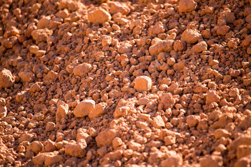 Red clay soil on nature as a background