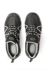 Tracking sneakers men's shoes isolated on white top view