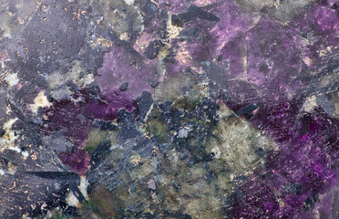 violet and black eudialyte texture macro
