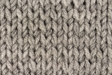 Gray knitting wool texture background. Macro