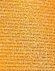 Drops of water on orange plastic as background