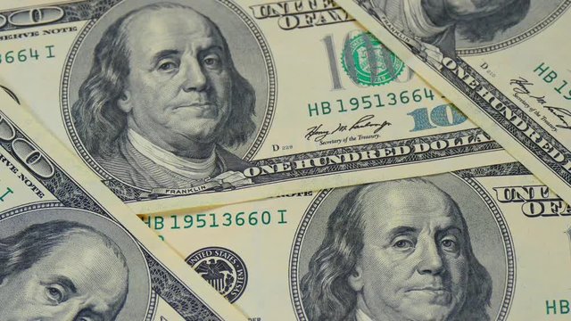 Hundred-dollar bills close-up, motion slider - 9. Macro photography of banknotes. Portrait of Benjamin Franklin.