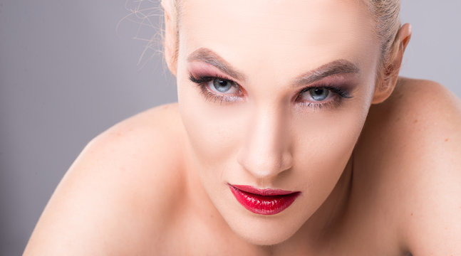 Close-up of sexy young blonde woman wearing make-up.