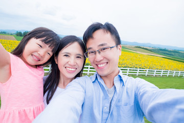 family selfie with sunflower