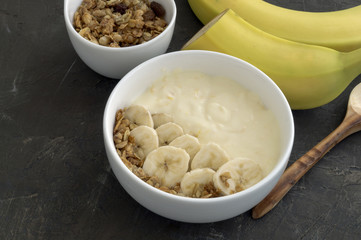 Natural homemade yogurt with muesli and banana.