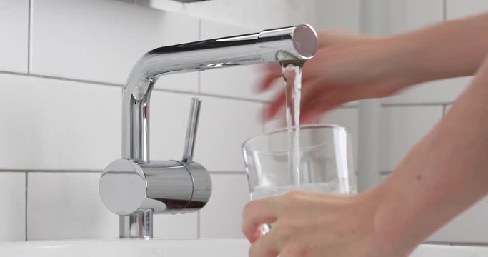 Filling glass of mains water, drinking water close-up