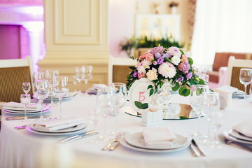  Wedding table served and decorated with flowers 