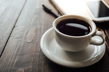 Cup of coffee on desk or workspace
