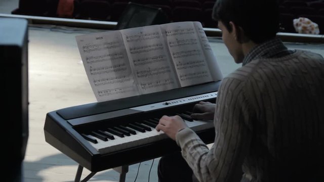 The pianist plays the synthesizer