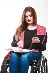 Girl with tabled and book.