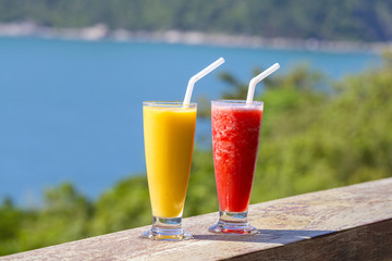 Two fresh organic shake from mango and watermelon in thai restaurant on the beach near sea , Thailand. Close up