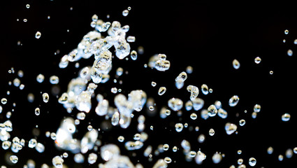 Splashing water from a fountain as an abstract background