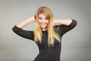 Fototapeta premium Portrait of happy blonde woman smiling with joy