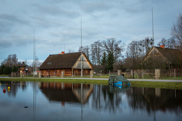 Fototapeta na wymiar Old house over the Wegorapa river in Wegorzewo, Masuria, Poland