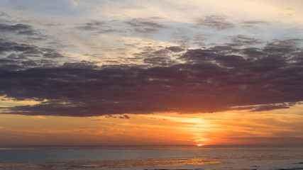 Fototapeta na wymiar Brilliant Sunset over the beach