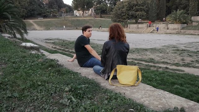 young couple pursues running the thief at the park