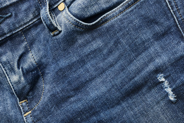 Fototapeta premium Close-up of a blue jean trousers, pocket